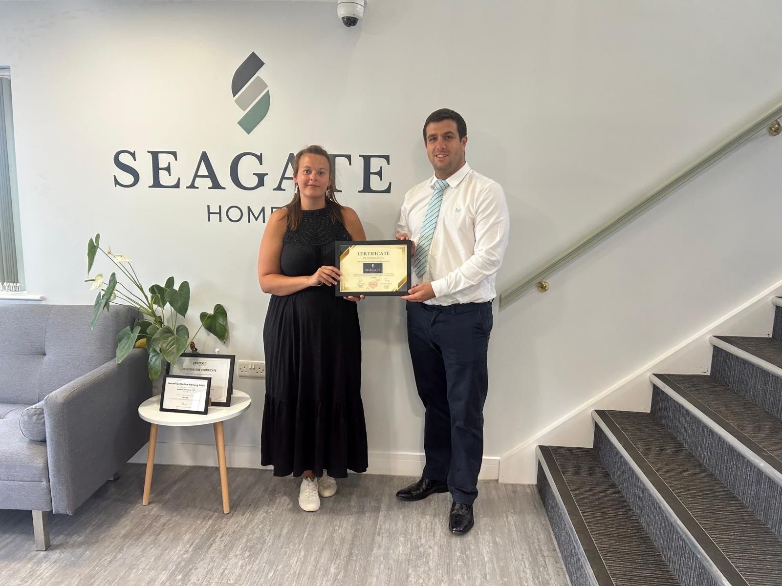 Kirsty and Adam from Seagate Homes receiving their headline sponsor certificate